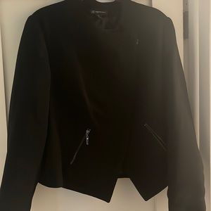 black INC asymmetrical jacket with gold zipper pocket worn one to